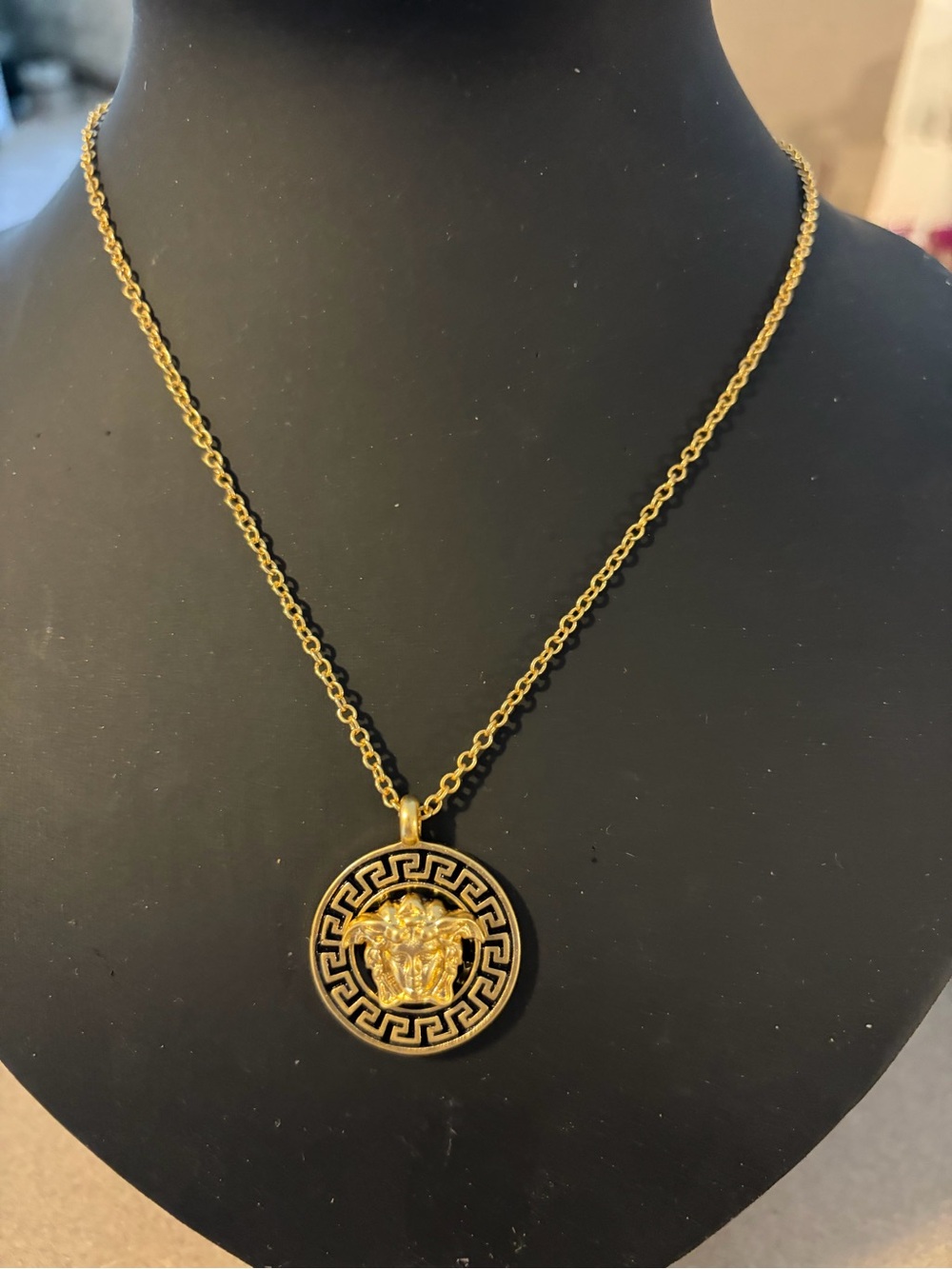 Gold Medallion Pendant Necklace with Black Enamel Detailing